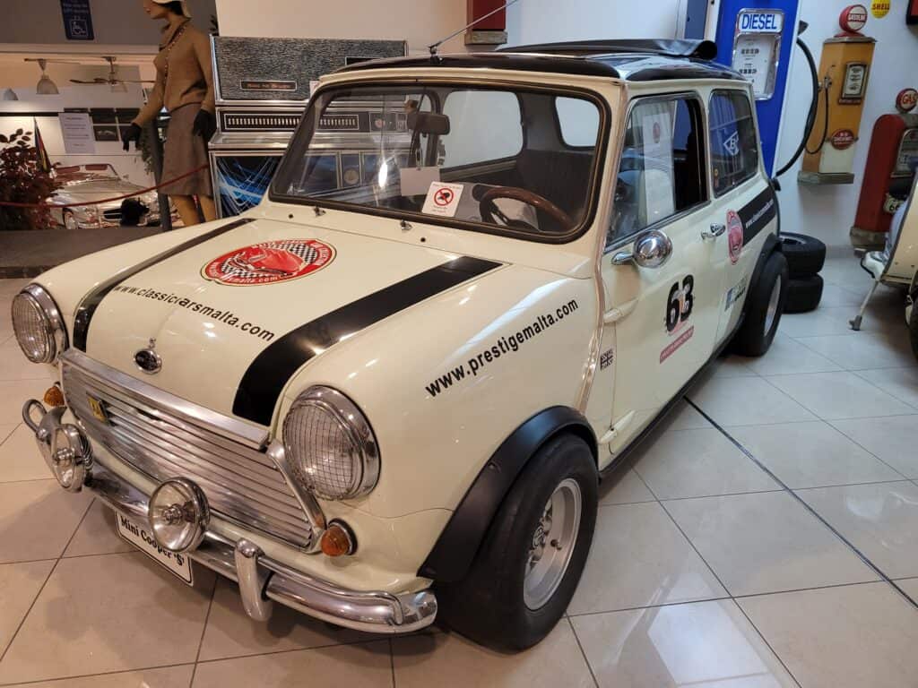 front side view of a cream-colored Mini Cooper
